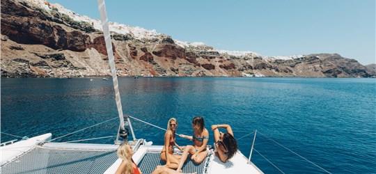 Photo of Beautiful Catamaran Cruise in Santorini with BBQ meal & drinks