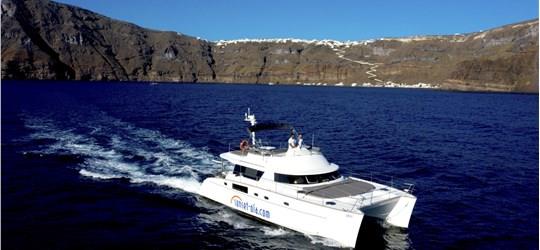 Photo of Private Power Catamaran Cruise in Santorini with BBQ and Drinks