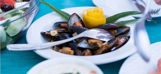 Photo of Caldera Gold Catamaran Cruise in Santorini with BBQ Meal and Drinks