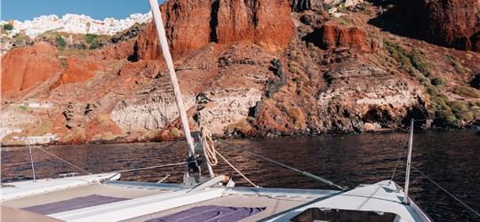 Photo of Beautiful Catamaran Cruise in Santorini with BBQ meal & drinks