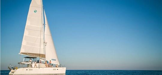 Photo of Caldera Gold Catamaran Cruise in Santorini with BBQ Meal and Drinks