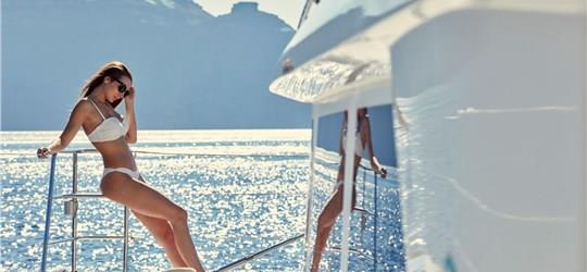 Photo of Luxurious Catamaran Cruise in Santorini with BBQ and Drinks