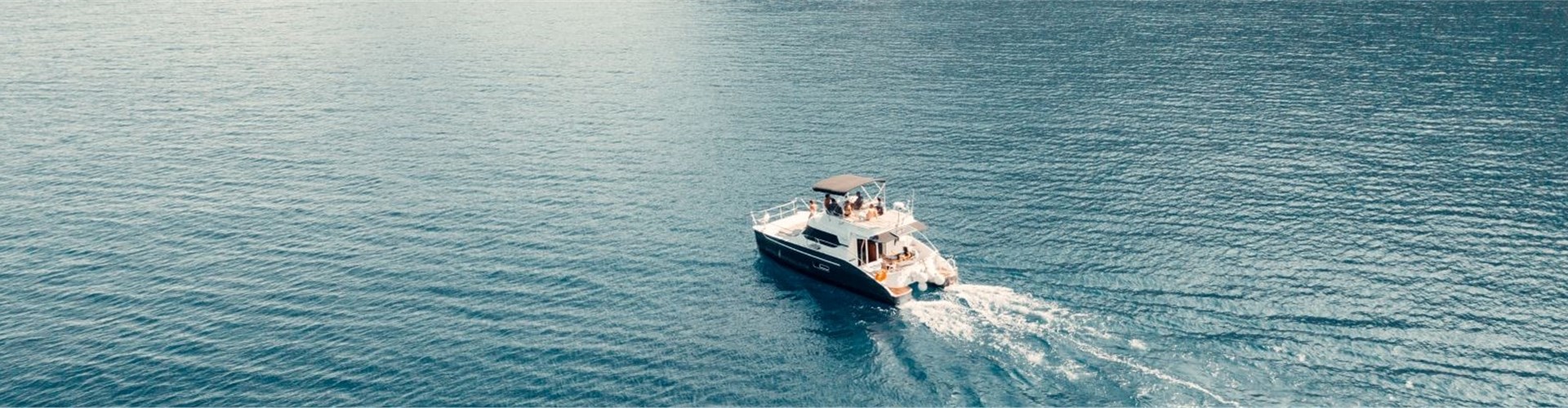 Photo of Caldera Private Power Catamaran Cruise with meal and drinks