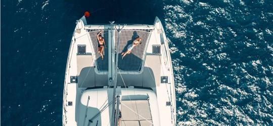 Photo of Beautiful Catamaran Cruise in Santorini with BBQ meal & drinks