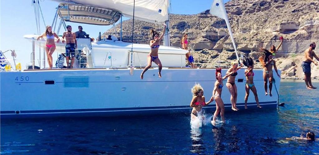 Photo of Caldera Gold Catamaran Cruise in Santorini with BBQ Meal and Drinks